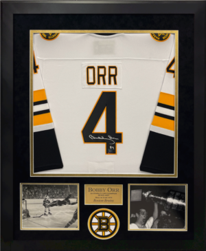 Custom Frame the jersey you provide with photos, team logo patch, and the in house laser plate is created with your favorite stats. New England Picture can frame any local team or teams from across the world. Fill out the custom framing form and email us a picture of the item you want framed. The framing cost for a similar jersey is priced between $350-$450 depending on the details.
