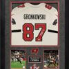 Custom Frame the jersey you provide with photos, team logo patch, and the in house laser plate is created with your favorite stats. New England Picture can frame any local team or teams from across the world. Fill out the custom framing form and email us a picture of the item you want framed. The framing cost for a similar jersey is priced between $350-$450 depending on the details.